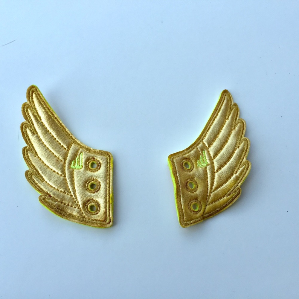 Two golden wing shwing shoe lace accessories